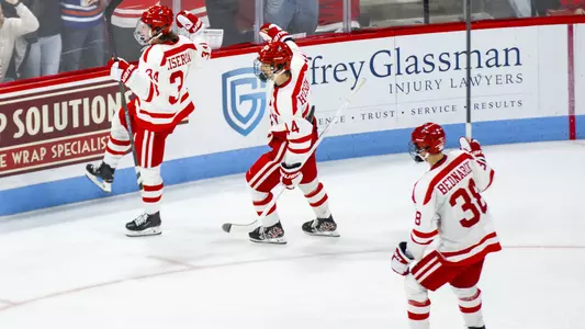 Cole Eiserman, Cole Hutson and Kamil Bednarik celebrate a goal