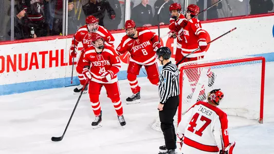 Boston University men's hockey players celebrate after scoring final goal at Matthews Arena