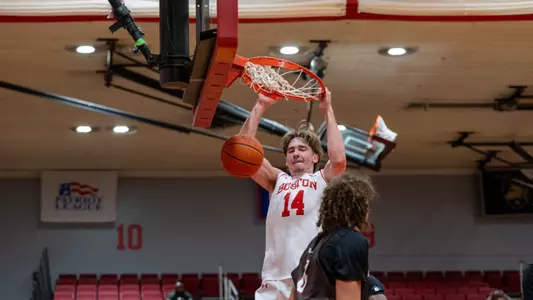 Ben Defty has a two-handed slam dunk against Brown