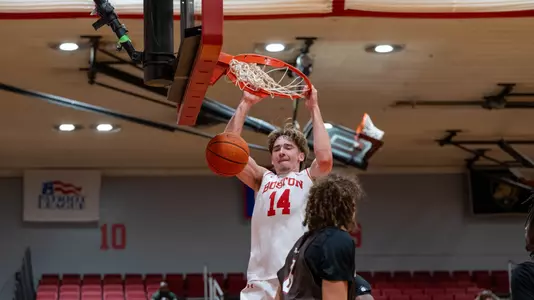 Ben Defty has a two-handed slam dunk against Brown