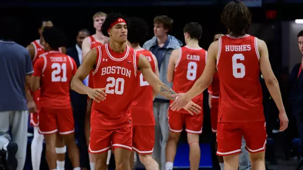 Michael McNair and Sam Hughes high-five one another during lineup announcements