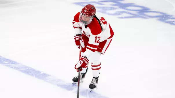 Avery Supryka skating with the puck