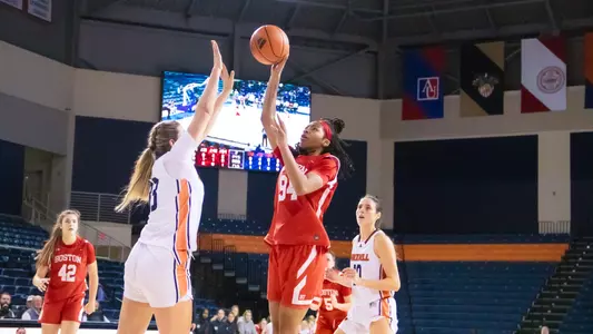 Photo of women's basketball sophomore Sierra Bentley shooting a floating jump shot at Bucknell.