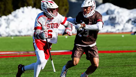 Mike Rooney playing lacrosse against Brown