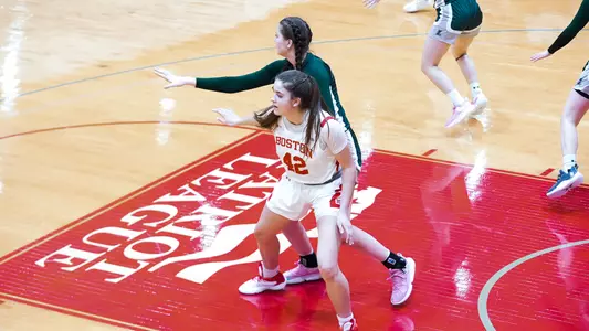 Photo of women's basketball freshman Allison Schwertner posting up against a Loyola Maryland defender.