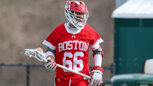 James Corcoran playing lacrosse