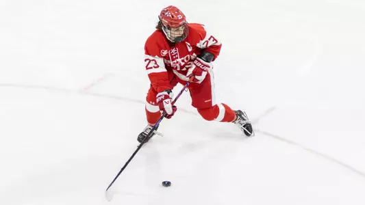 Tamara Giaquinto playing hockey against UConn