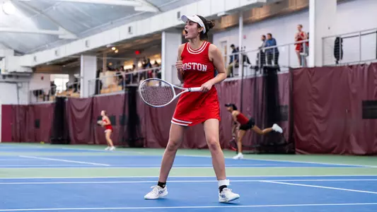 Rhea Rai celebrates winning a point on a tennis court