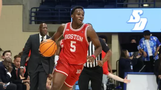 Kyrone Alexander dribbles the ball up the court at San Diego.