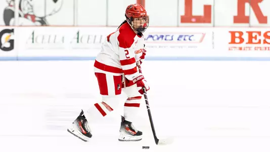 Maeve Carey playing hockey