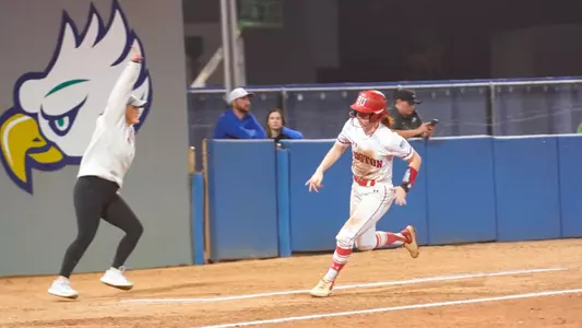 Ashley Waters waves a runner home from second as the Terrier rounded third