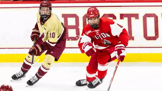Brandon Svoboda skating against James Hagens of Boston College