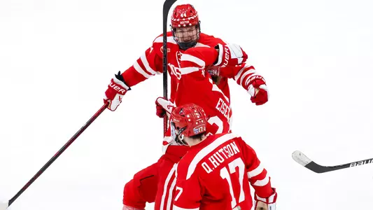 Cole Hutson, Cole Eiserman and Quinn Hutson celebrate a goal