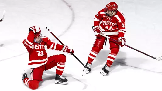 Cole Hutson and Cole Eiserman celebrate a BU goal