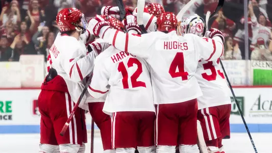 Men's ice hockey players celebrating a win