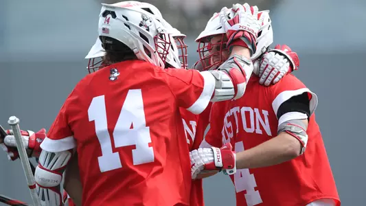 BU men's lacrosse players celebrate a goal at Army