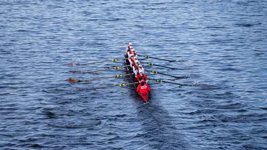 Photo of the BU Lightweight Rowing Varsity 8+ racing against Boston College.