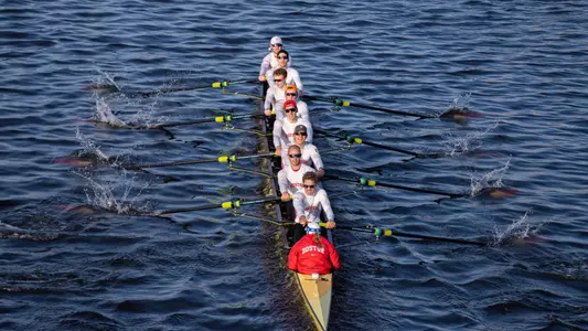 Photo of the BU Men's Rowing Varsity 8 racing against Brown.