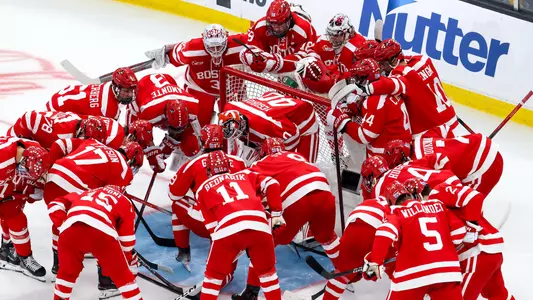 Men's ice hockey players huddle before a game