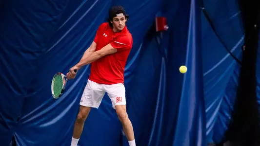 Jonah Dickson hitting a backhand shot