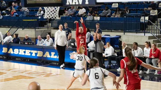 Photo of women's basketball sophomore Audrey Ericksen shooting a three-pointer at Navy.