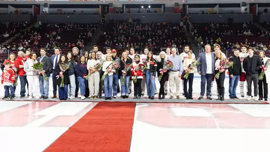 BU Men's Hockey Class of 2025 and their families on Senior Night at Agganis Arena