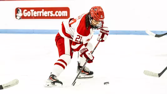 Riley Walsh about to shoot the puck