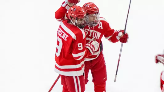 Ryan Greene and Quinn Hutson celebrate a goal at Vermont