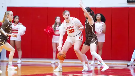 Photo of women's basketball junior Anete Adler dribbling the ball against a Lehigh defender.