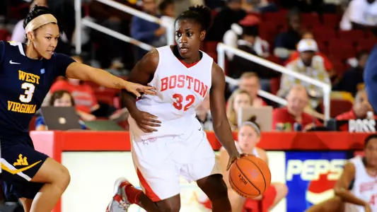 Photo of women's basketball alumna Chantell Alford dribbling the ball against West Virginia.