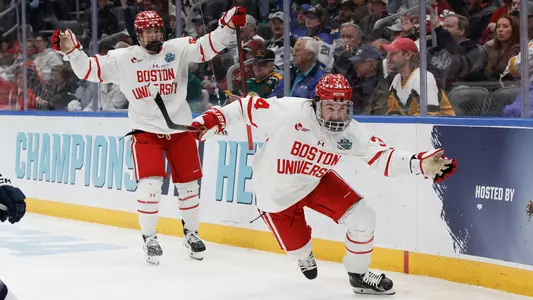 Cole Eiserman celebrates his goal against Penn State at the Frozen Four, with Cole Hutson celebrating behind him