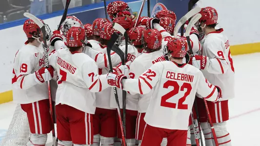 BU men's hockey players celebrating a win together