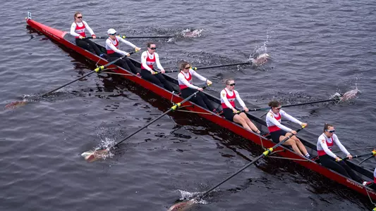 Photo of a Lightweight Rowing 8 racing on the Charles River.