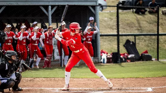 Kylie Doherty is in a batting stance awaiting a pitch from Holy Cross