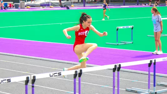Kendall Barnhart Jumping Over a Hurdle