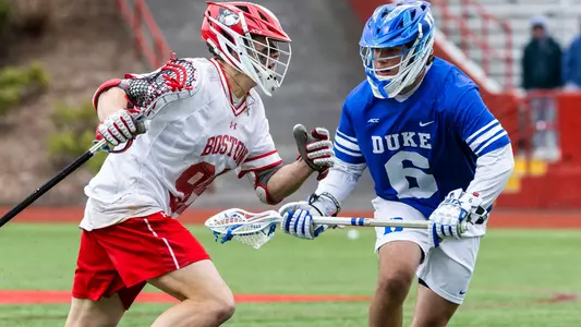 Andrew Pape playing lacrosse against Duke