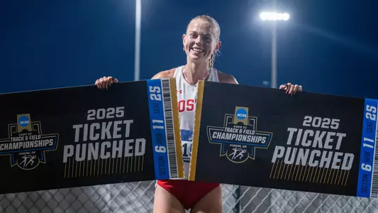 Vera Sjöberg Holding Two Ticket Punched Signs