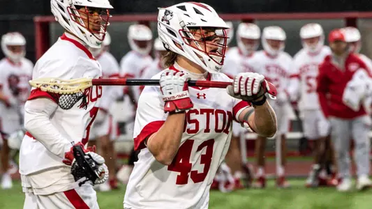 Daine Kostes playing lacrosse