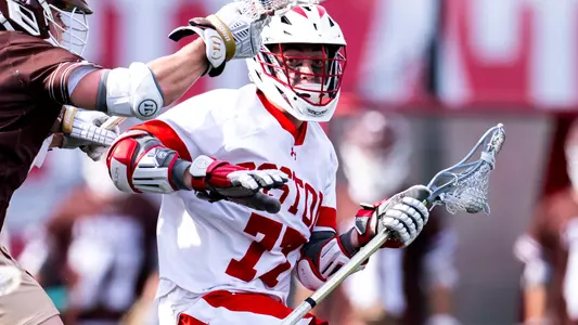 Finn Lawrence playing lacrosse