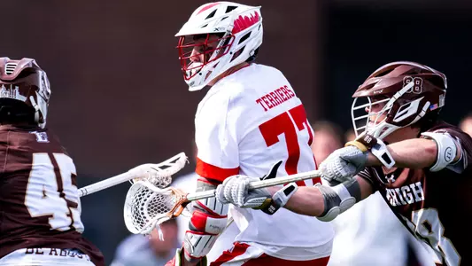 Finn Lawrence playing lacrosse