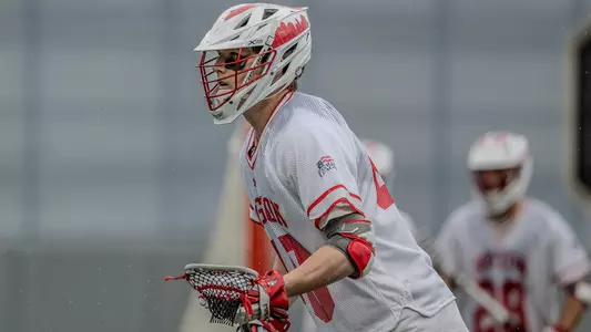 Jackson Matthews playing lacrosse