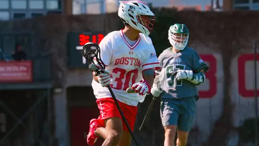 Simon Miklaszewski playing lacrosse