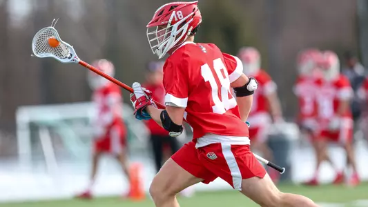 Logan Styles playing lacrosse