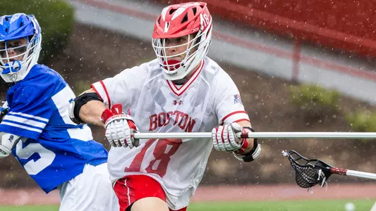 Logan Styles playing lacrosse