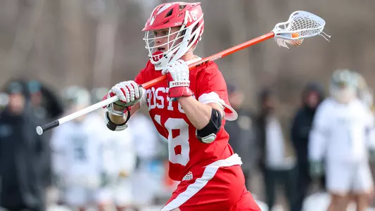 Logan Styles playing lacrosse