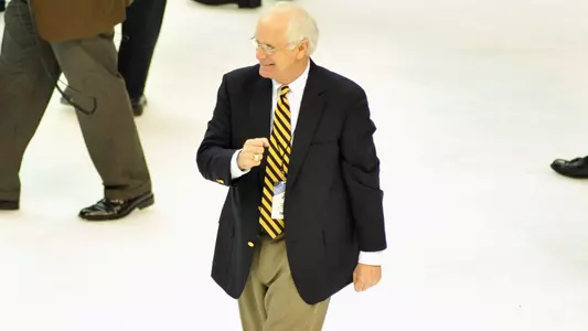 Jack Parker celebrating on the ice after winning the 2009 national title