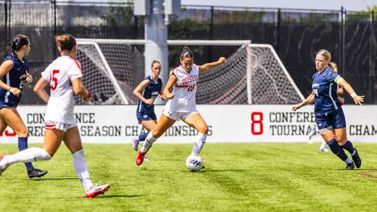 Photo of women's soccer sophomore Juliana Osterman about to shoot the ball at Nickerson Field.