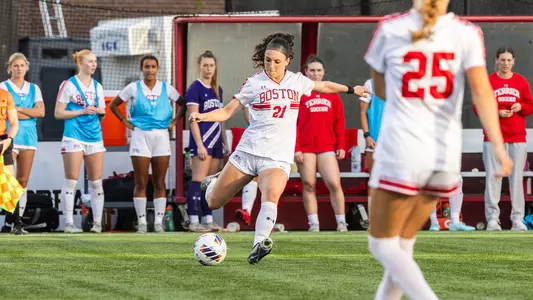 Photo of women's soccer senior Helene Tyburczy about to kick a free kick.