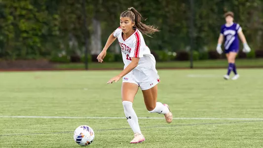 Photo of BU women's soccer freshman Nina Tzouganatos dribbling the ball at Nickerson Field.