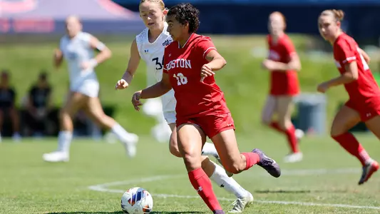 Photo of BU women's soccer senior Shayla Brown dribbling the ball at Saint Mary's.